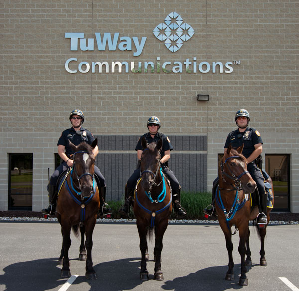 Pictured, from left to right, are mounted Officers Leaser, Brooks and Buskirk.  Their respective partners are George, Raven and Pharaoh.